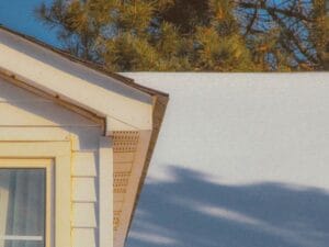 snow covered residential roof winter weather roof stress